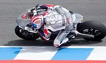 Michael Czysz riding the MotoCzysz E1pc electric racing motorcycle