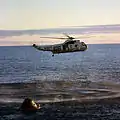 A member of the Apollo 10 crew is hoisted into a SH-3D Sea King from  Princeton on 26 May 1969
