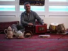 Image 31Elements of Afghan culture including: tabla and harmonium musical instruments, an Afghan carpet, teapot, and sheer pira dessert (from Culture of Afghanistan)