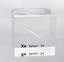 A partly filled ampoule containing a colorless liquid