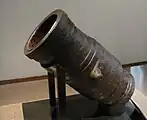 Bombarde-Mortier, La Fère, wrought iron, the second half of the 15th century. Length: 1m, caliber:35cm, weight: 600kg. In this weapon, the powder chamber was cast from molten metal, while the barrel was constructed "à tonoille".