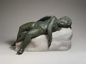 Statue of Eros sleeping; 3rd–2nd&nbsp;century&nbsp;BC; bronze; 41.9 × 35.6 × 85.2&nbsp;cm, 124.7&nbsp;kg, height with base: 45.7&nbsp;cm; Metropolitan Museum of Art (New York City)