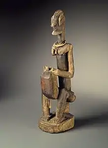Figure of a seated musician (koro player); late 18th century; 55.8 x 17.7 x 10.8&nbsp;cm (22 x 7 x 41⁄4 in.); Brooklyn Museum (New York City)
