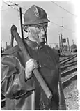A brown coal miner with a pickaxe. West&nbsp;Germany, 1952