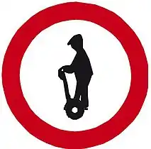 B 30a Zákaz vjezdu osob na osobních přepravnících (Entry of persons on personal transporters prohibited)