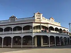 Castle Hotel, York; verandah and timber fretwork added c. 1905.