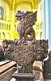 Christ Church, Welshpool. Carved Pew end with Powis arms and crest