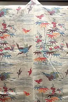 The back view of a white kimono dyed with bingata.