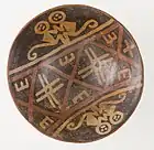 Footed bowl depicting a pair of monkeys; 750–1250; resist-painted ceramic; height: 8.9&nbsp;cm (31⁄2 in.), diameter of the bowl: 20.48&nbsp;cm (81⁄16 in.), diameter of the foot: 7.94&nbsp;cm (31⁄8 in.); Los Angeles County Museum of Art (USA)