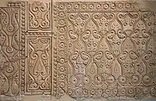 Carved stucco panels from Samarra (9th century) in Style C or  "beveled" style, showing flatter and more abstract motifs (at the Museum of Islamic Art, Berlin)