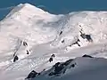 Great Needle Peak from Miziya Peak, with Sliven Peak and Atanasov Nunatak in the foreground, Huron Glacier with Kukeri Nunataks and Nestinari Nunataks in the middle, and Great Needle Peak and St.&nbsp;Ivan Rilski Col surmounting Plana Peak and Kardam Buttress in the background