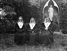 Three nuns sitting