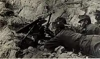 M15 with a gun shield and its trail folded backward on a mountain
