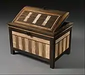 Inlaid box for cosmetic vessels of Sithathoryunet; 1887–1813 BC; ebony, inlaid with ivory and red wood (restored) and gold trim; height: 25.2&nbsp;cm, length: 36.4&nbsp;cm, depth: 25.2&nbsp;cm; Metropolitan Museum of Art