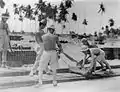 Japanese prisoners of war laying some of the 11,900 rolls of bituminised hessian sheeting that provided a waterproof bedding for the main runway at Changi.