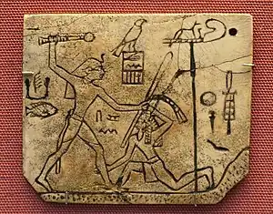 Tag depicting king Den; c.&nbsp;3000&nbsp;BC; ivory; 4.5 × 5.3&nbsp;cm; from Abydos (Egypt); British Museum (London)
