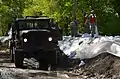 North Dakota National Guard soldiers place poly over temporary emergency levee on June 2, 2011.