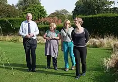 Lorna Slater and representatives from NatureScot and Friends of Saughton Park walk in a park