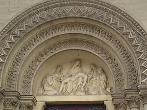 Tymanum of the central portal with sculpture of a Pieta by Joseph Tournois (1830-1891)