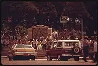 People congregate in the town square during a parade in June 1974