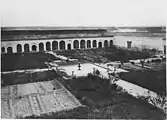 Another view of the menagerie courtyard, looking southwest; the arches along the far wall held cages for lions or other animals (photo from 1913)