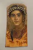Portrait of a young woman in red; c.&nbsp;90–120&nbsp;; encaustic painting on limewood with gold leaf; height: 38&nbsp;cm (15&nbsp;in); Metropolitan Museum of Art (New York City)