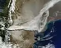 Image showing a large plume of volcanic ash blowing about 800&nbsp;kilometers east and then northeast over Argentina.