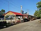 Restored rail cars and statue of Garfield on the Sweetser Switch Trail