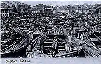 Boat Quay during its heyday around 1865, when as many as 150 boats moored on the river, trading everything from rubber, tin and iron, to silk, porcelain, rice, opium, spices and coffee.