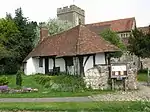 Timber-framed building in the south-west corner of the churchyard of Church of St Mary (Pest House)