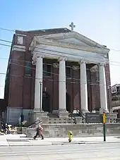 large multi-storey building with multi-storey columns at the front of the building