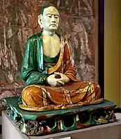 Stoneware figure of a luohan, from Yixian, China, Liao Dynasty, 907-1125 CE. British Museum