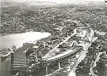 Aerial view of Milsons Point during construction of the Sydney Harbour Bridge