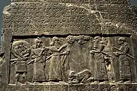 The Black Obelisk of Shalmaneser III. The king, surrounded by his royal attendants and a high-ranking official, receives a tribute from Sua, king of Gilzanu (north-west Iran), who bows and prostrates before the king. From Nimrud, northern Mesopotamia (Iraq). Neo-Assyrian period, 825 BC. The British Museum, London.