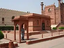 Iqbal's mausoleum adjacent to the Badshahi Mosque's gateway