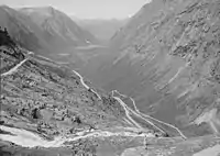 The deep U-shaped Isterdalen&nbsp;[no] valley in Norway ends abruptly giving rise to tall waterfalls. Trollstigen road climbs the steep cliffs of the trough end.