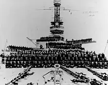 Hyperboloid mast towers were on the USS&nbsp;Arizona, with the ship's complement posing on her forecastle, forward turrets and superstructure, circa 1924.