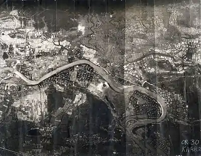 The 3rd Aerospace Rescue Recovery Group used this mosaic reconnaissance photograph to plan Lt. Col. Hambleton and 1st Lt. Mark Clark's rescue. The Cam Lo Bridge is shown at the far left. On 7 April, Hambleton was about 1,000 yards (910 m) above the river and Clark was near the river.: 76