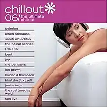 A woman wearing a pink tank top lounges on a white chair with headphones on; above her, the title of the album is visible on a pink background in a white font.