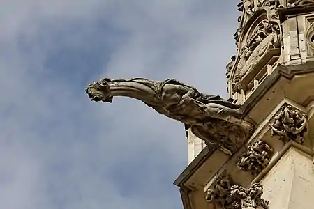 A gargoyle, serving as a rain spout