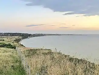 Waikato Point. Cliffs rise to about 30&nbsp;m (98&nbsp;ft) on the west coast of the lagoon