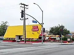 A Wienerschnitzel restaurant located in Norwalk, California, with the steep yellow A-shaped roof of many Weinerschnitzel buildings